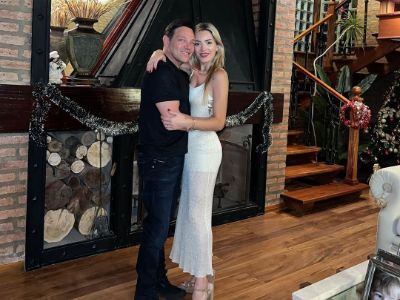 Christina Invernizzi and Jordan Belfort are hugging each other for the picture.